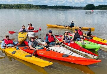 Individuals enjoying a kayaking event