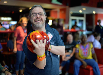 Individual getting ready to throw his bowling ball down the lane