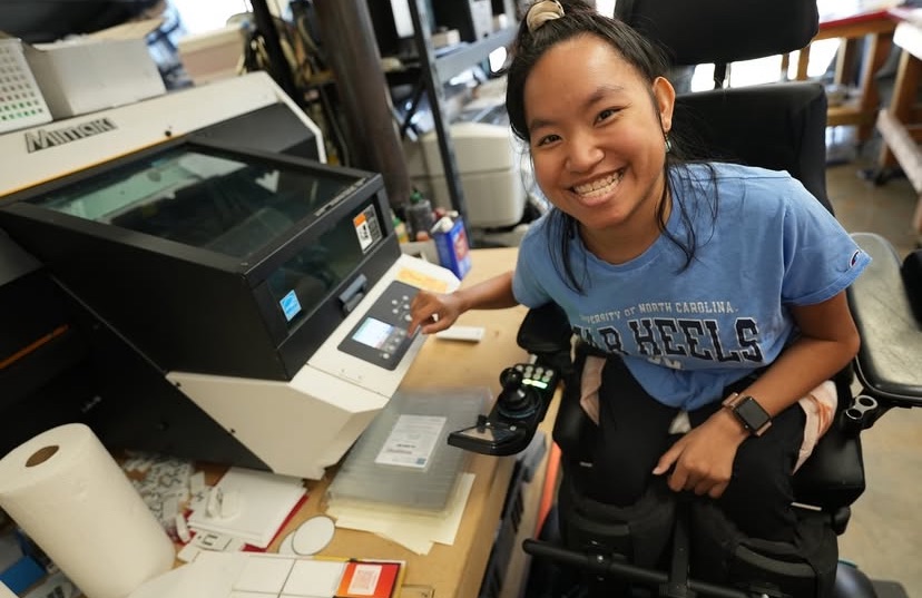 Elianna, a G House resident, working in The G Day print shop